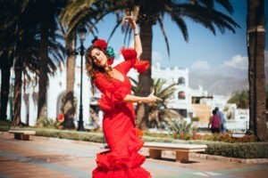 Woman dancing flamenco in traditional clothing